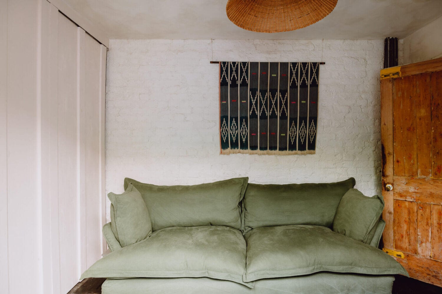 A Victorian Watch Shop is Now a Warm Sustainable Home 10 living-room-green-sofa-historic-home-london-nordroom
