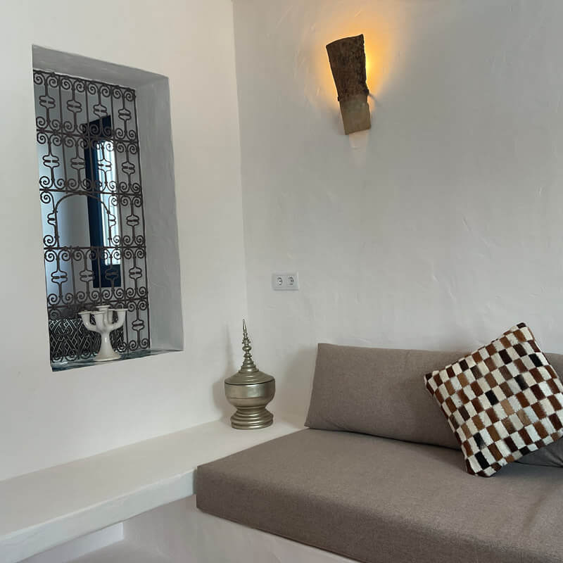 Casita Alborán: A Stylish Home in a Spanish Seaside Town 4 living-room-window-gray-cushions-nordroom