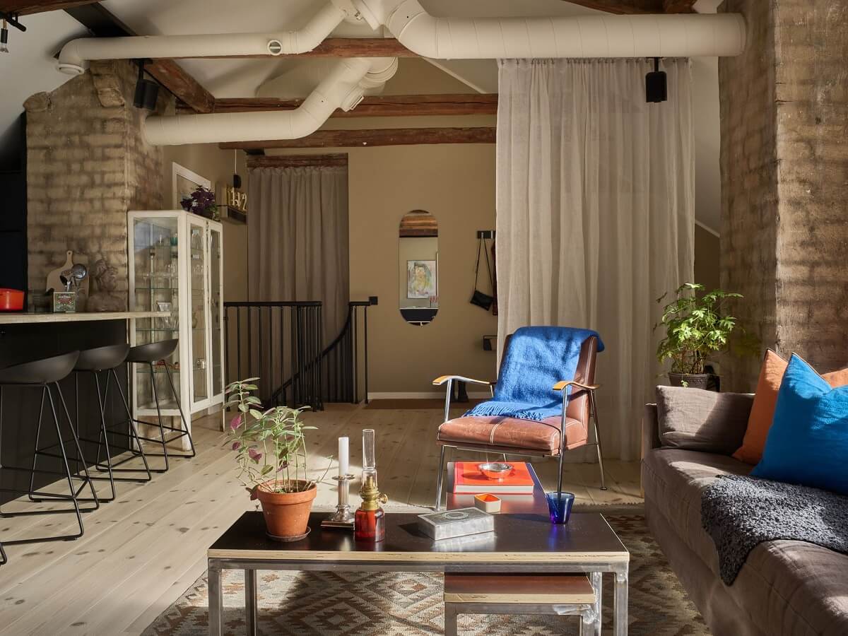 A Scandinavian Penthouse Apartment with Slanted Ceilings 8 living-space-loft-exposed-brick-nordroom