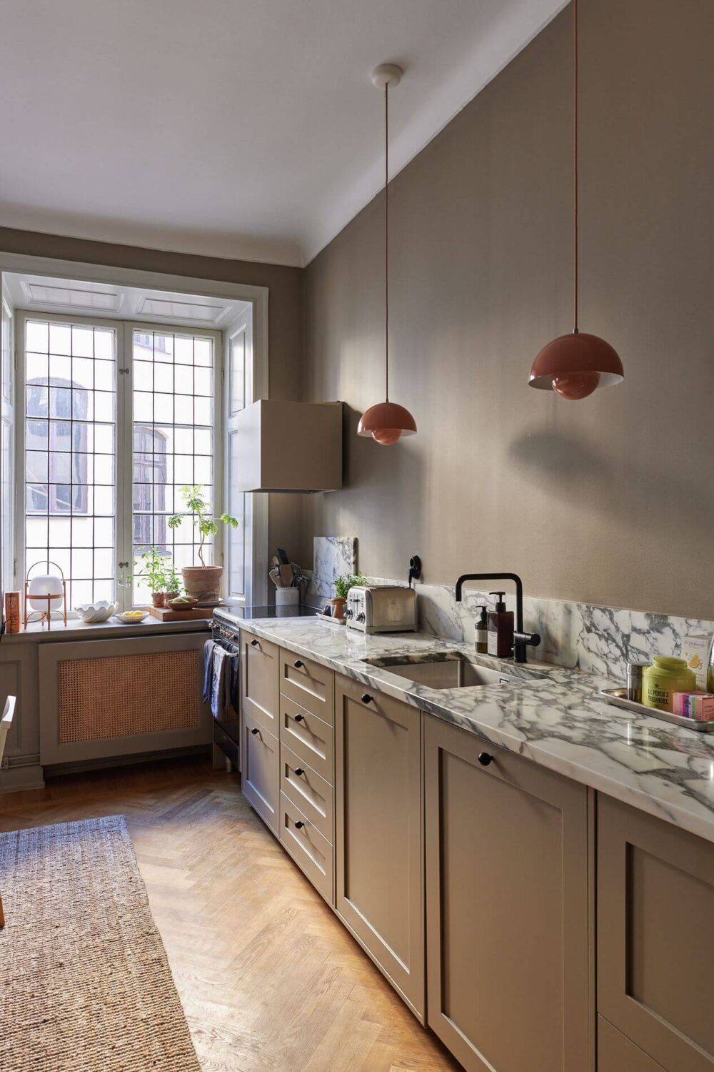Light Brown Walls in a 17th Century Apartment in Sweden 11 marble-worktop-kitchen-light-brown-walls-cabinets-nordroom