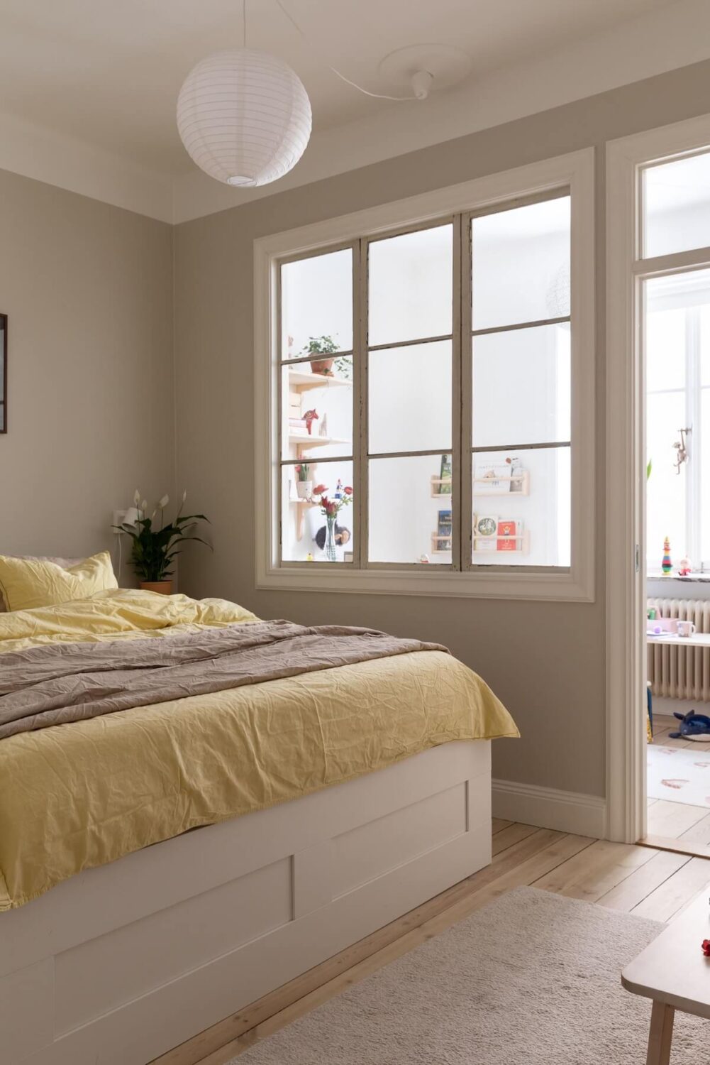 A Pink Living Room in a Scandinavian Apartment 13 master-bedroom-indoor-window-light-gray-walls-wooden-floor-nordroom