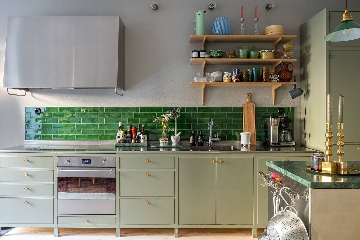 A Swedish Townhouse with a Light Green Kitchen 3 mint-green-kitchen-glossy-green-backsplash-tiles-shelves-nordroom