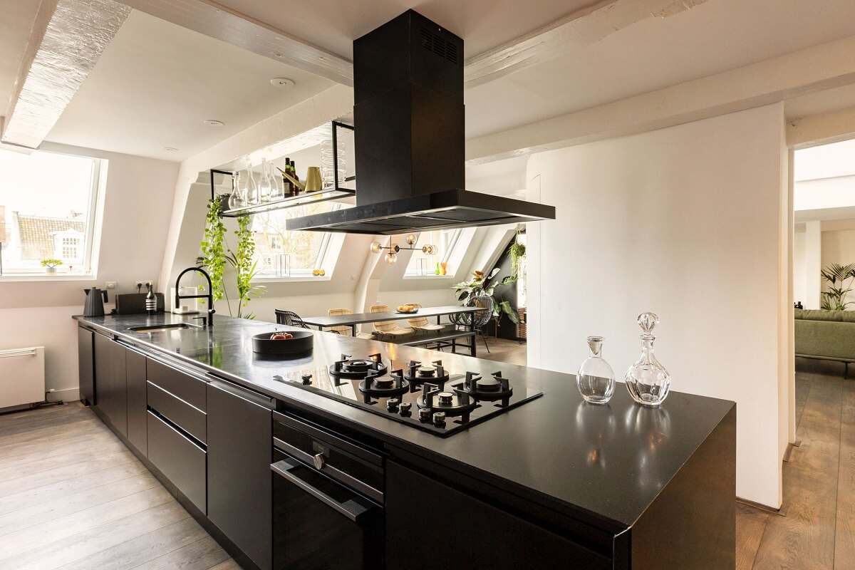 An Amsterdam Penthouse with Green Color Accents 12 modern-black-kitchen-island-penthouse-nordroom