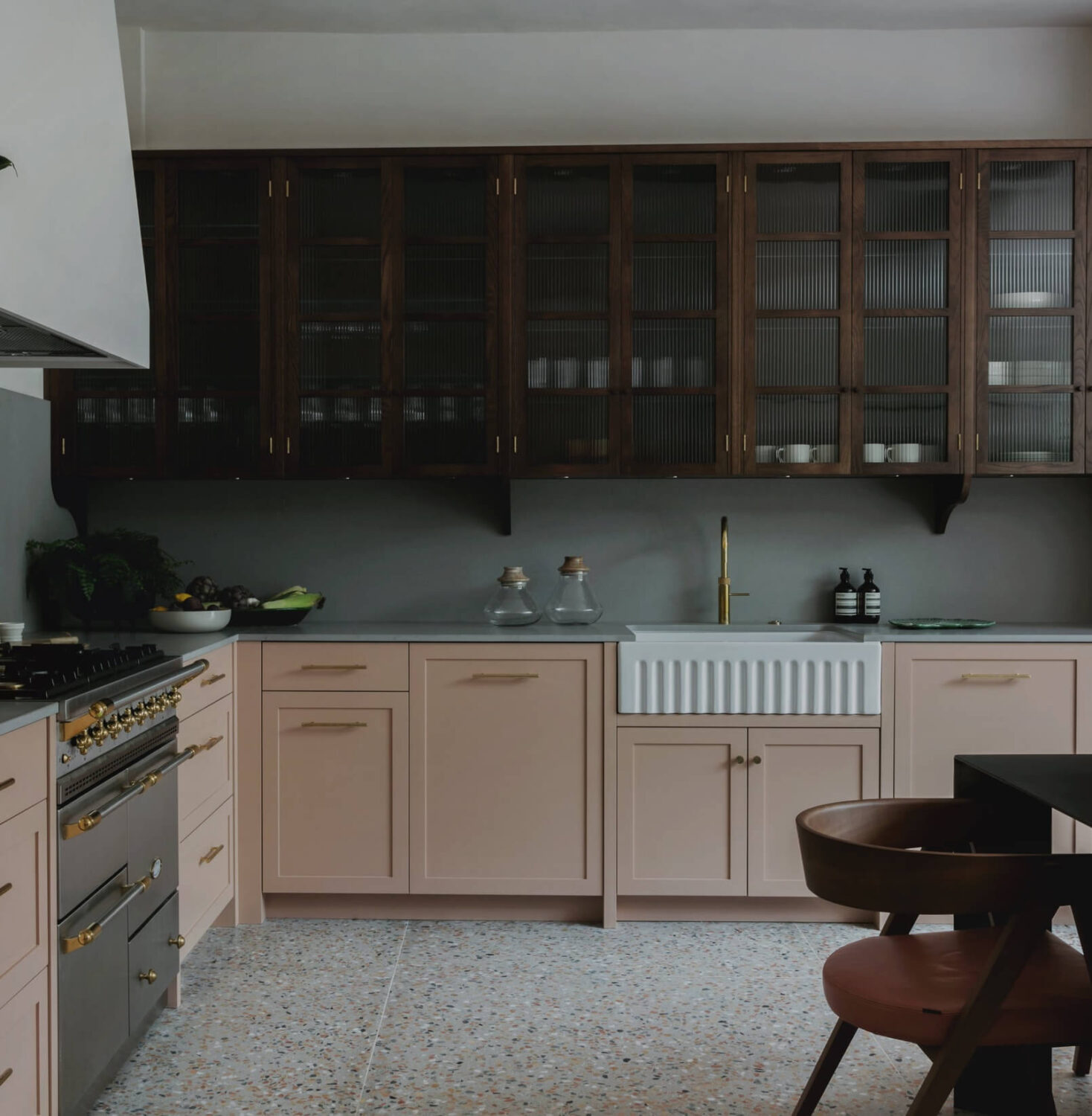 57 Stylish Two-Tone Kitchen Cabinet Ideas 45 pastel-pink-cabinets-with-natural-wood-ribbed-glass-upper-cabinets