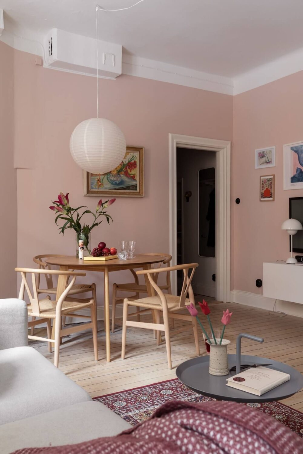 A Pink Living Room in a Scandinavian Apartment 9 pink-living-room-round-dining-table-nordroom