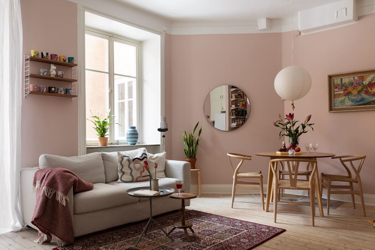 A Pink Living Room in a Scandinavian Apartment 4 pink-walls-paint-living-room-round-mirror-nordroom
