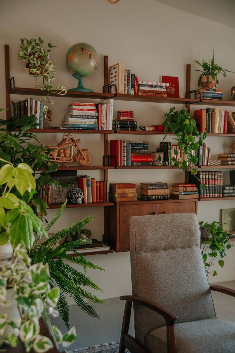 A Colorful Airbnb Home in the Morongo Valley 12 reading-room-bookshelves-plants-nordroom