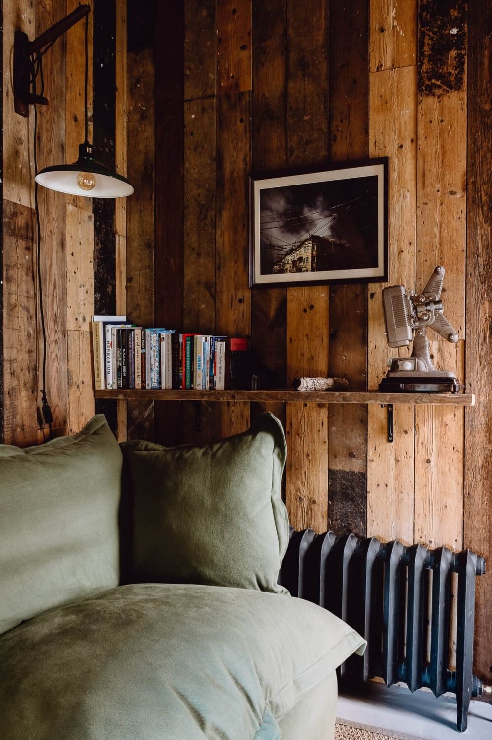A Victorian Watch Shop is Now a Warm Sustainable Home 12 reclaimed-timber-walls-sitting-room-reading-nook-shelf-nordroom