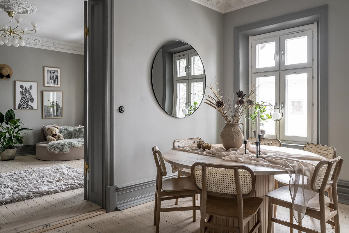 Gray Tones in a Classic Historic Scandinavian Home 21 round-dining-table-mirror-kitchen-nordroom