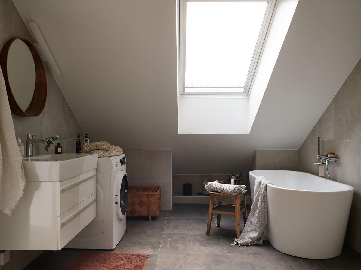 A Scandinavian Penthouse Apartment with Slanted Ceilings 19 scandinavian-bathroom-freestanding-bath-nordroom
