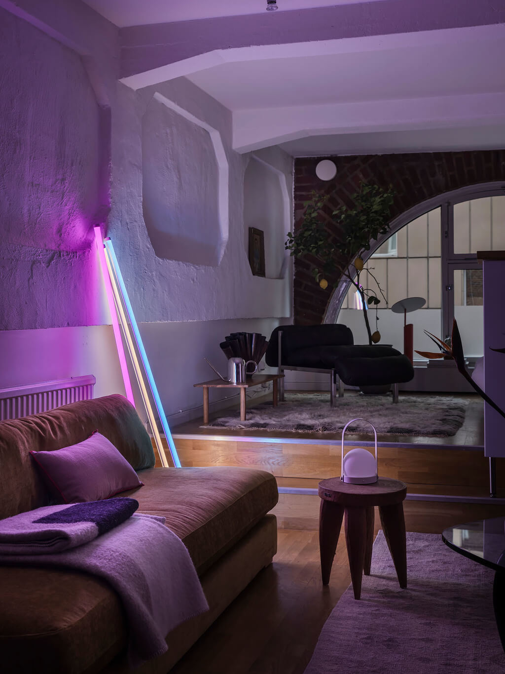 A Scandinavian Loft with Brick Wall and Arched Window 5 scandinavian-loft-apartment-at-night-colorful-lighting-nordroom