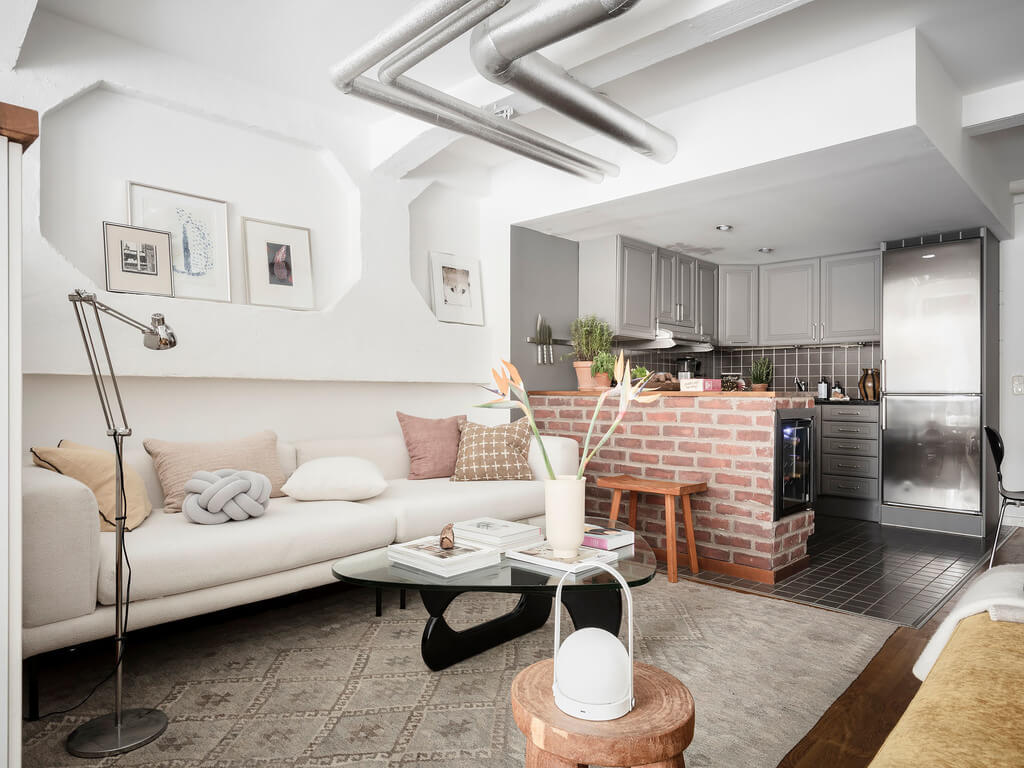 A Scandinavian Loft with Brick Wall and Arched Window 14 seating-area-scandi-loft-nordroom