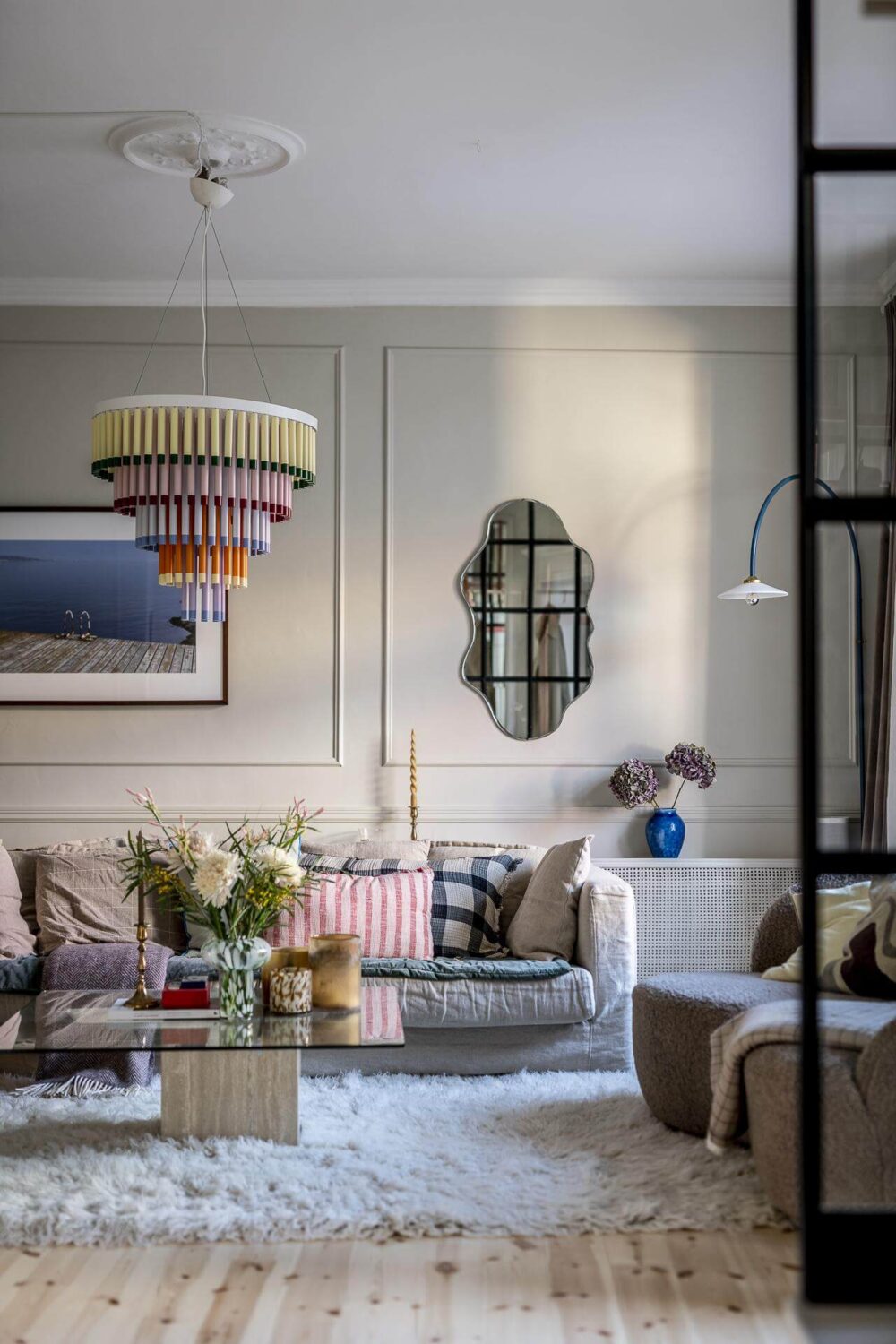 A Swedish Maisonette with a Blue Kitchen and Wallpaper 4 serene-living-room-steel-glass-wall-beige-walls-nordroom
