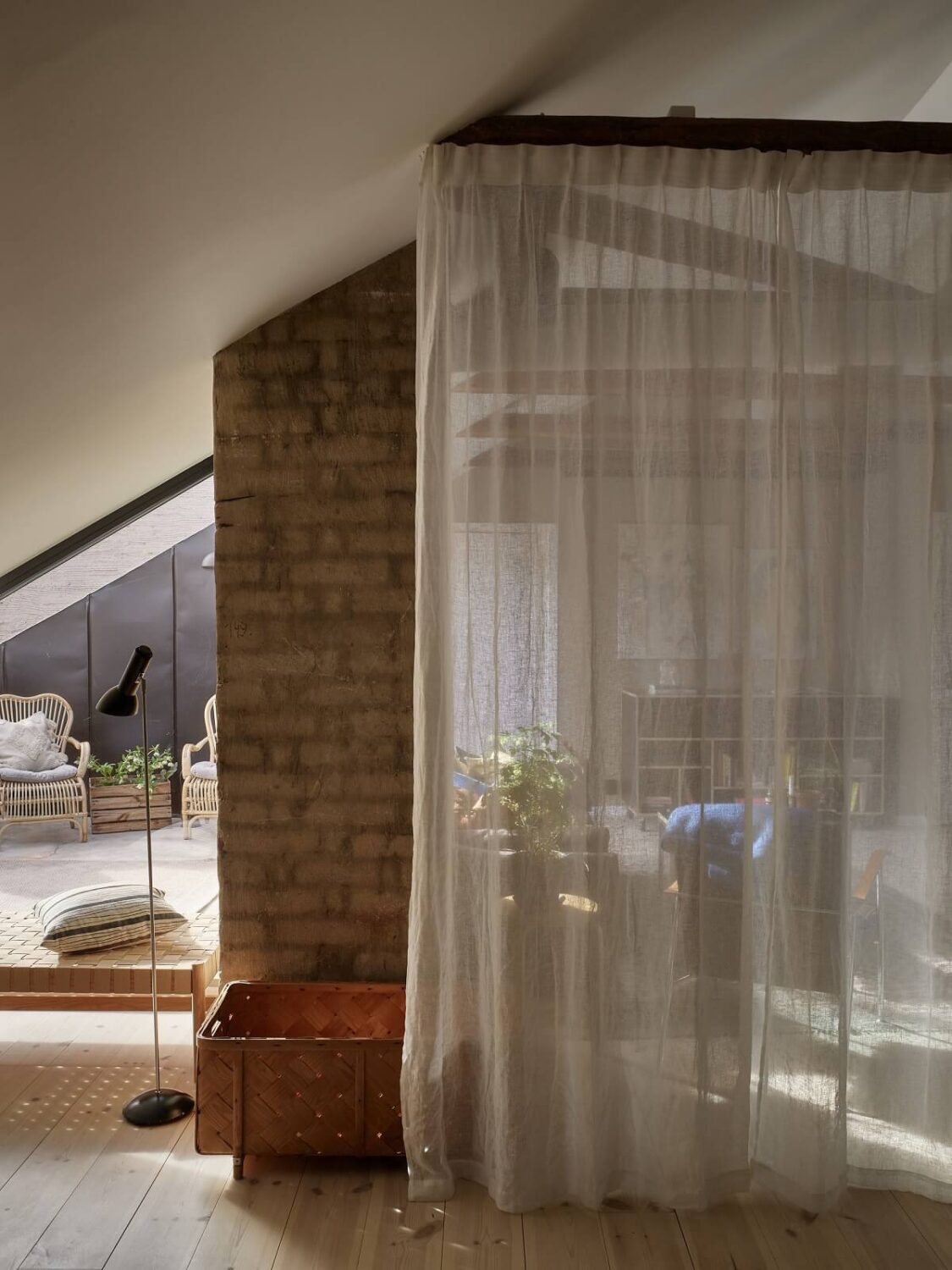 A Scandinavian Penthouse Apartment with Slanted Ceilings 9 sheer-curtain-penthouse-loft-nordroom