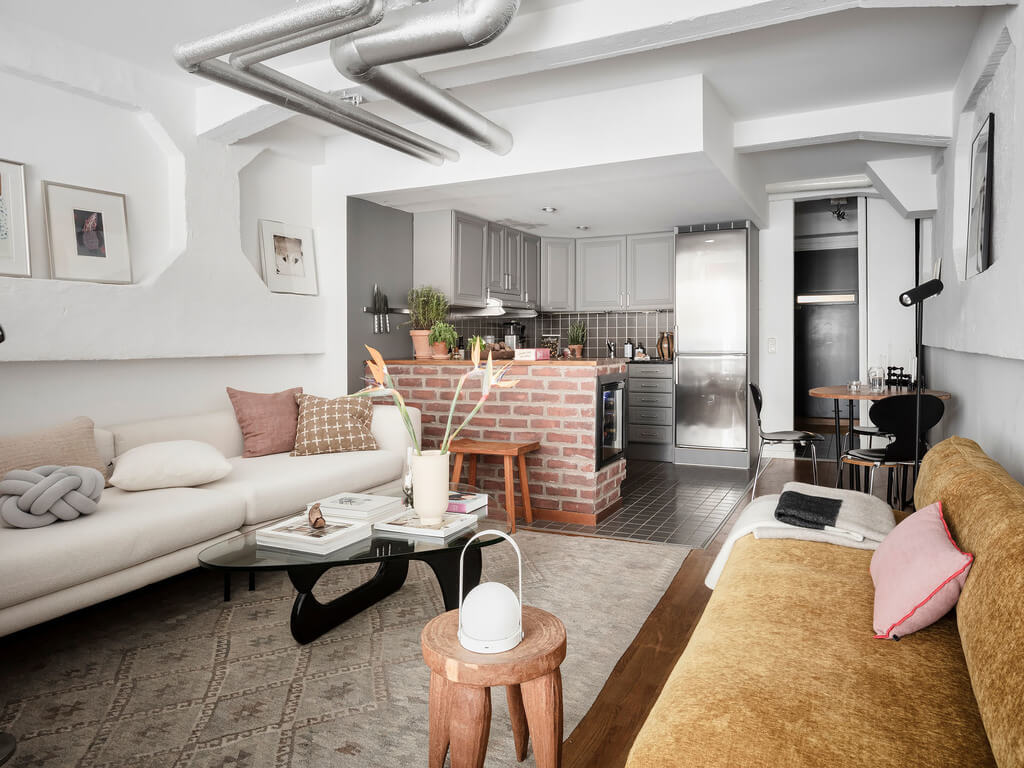 A Scandinavian Loft with Brick Wall and Arched Window 13 sitting-room-small-nordic-loft-ochre-yellow-sofa-nordroom
