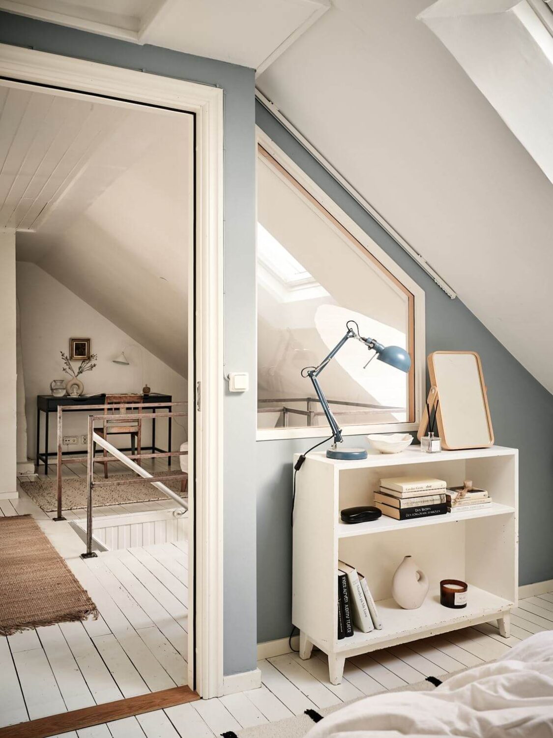 A White Scandinavian Attic Apartment 14 small-attic-bedroom-blue-walls-nordroom