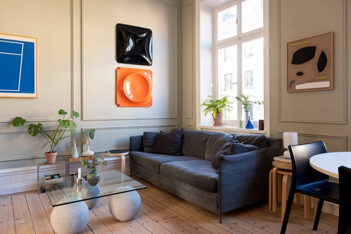 A Small Stockholm Apartment with Lovely Natural Light 7 small living room art glass coffee table wooden floor nordroom