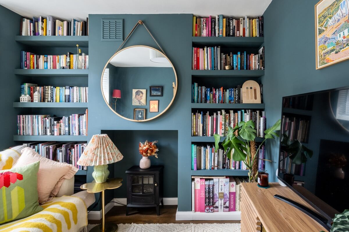 Blue and Green Tones in a London Home 7 small-living-room-bookshelves-large-round-mirror-nordroom