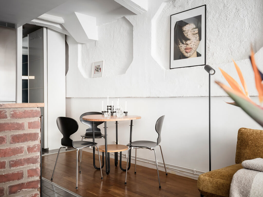 A Scandinavian Loft with Brick Wall and Arched Window 16 small-round-dining-table-loft-nordroom