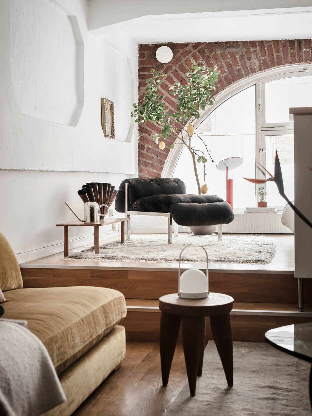 A Scandinavian Loft with Brick Wall and Arched Window 4 split-level-scandinavian-loft-ochre-yellow-sofa-nordroom