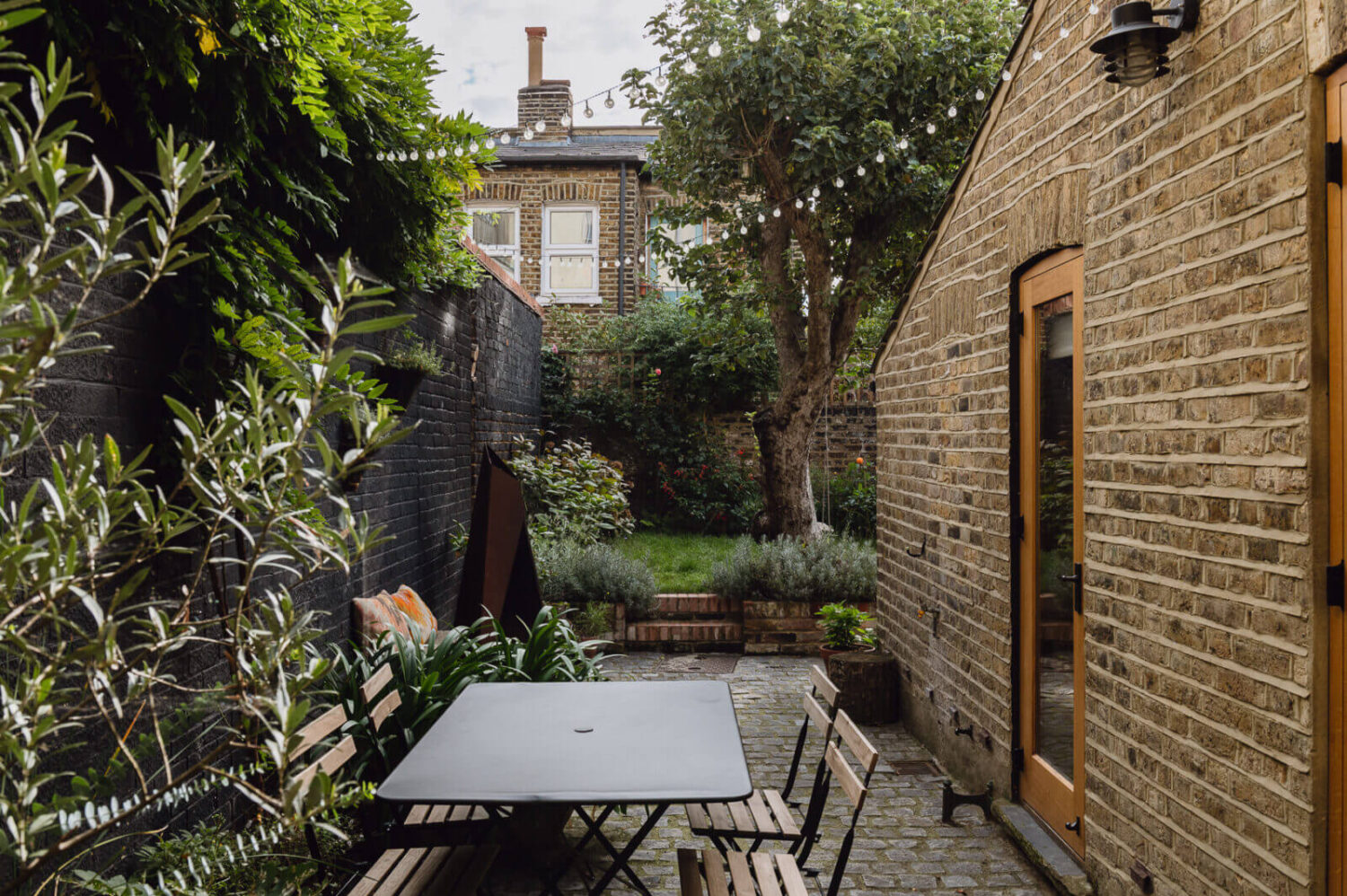A Victorian Watch Shop is Now a Warm Sustainable Home 22 terrace-garden-london-home-nordroom