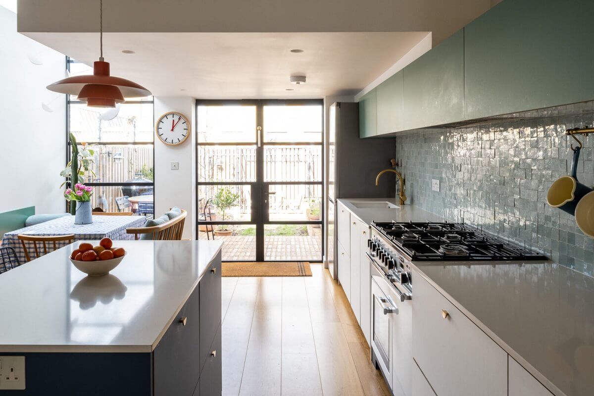 Blue and Green Tones in a London Home 3 two-tone-kitchen-cabinets-island-nordroom