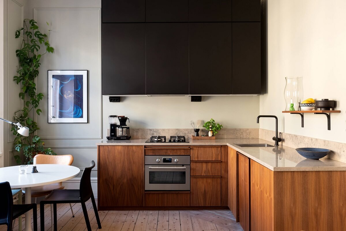 A Small Stockholm Apartment with Lovely Natural Light 4 walnut kitchen cabinets limestone worktop nordroom