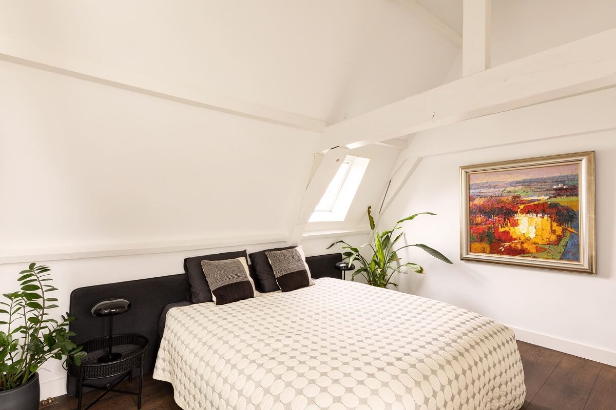 An Amsterdam Penthouse with Green Color Accents 15 white-bedroom-pitched-roof-nordroom