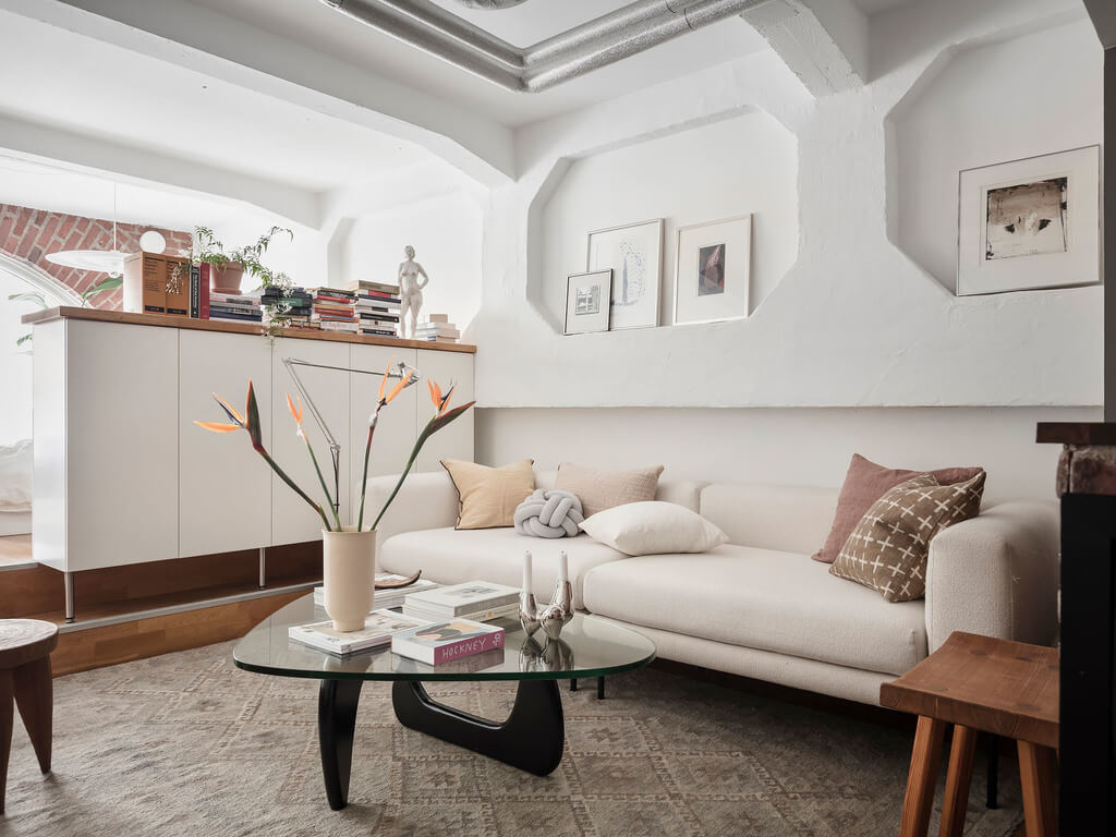 A Scandinavian Loft with Brick Wall and Arched Window 3 white-sofa-wall-with-niches-scandi-loft-nordroom