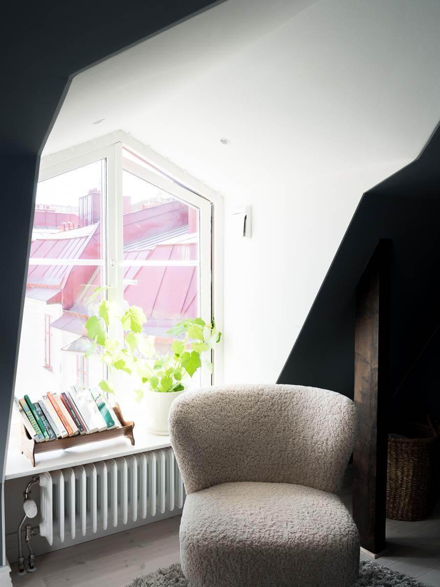 A Scandinavian Duplex That Blends Old and New 15 attic-bedroom-reading-nook-nordroom