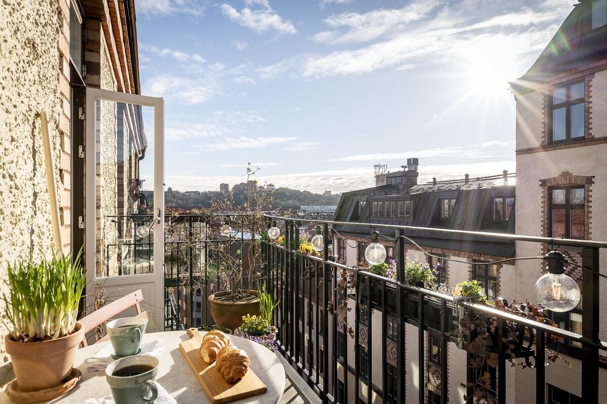 A Scandinavian Apartment with a Pale Yellow Kitchen 6 balcony-view-of-gothenburg-nordroom