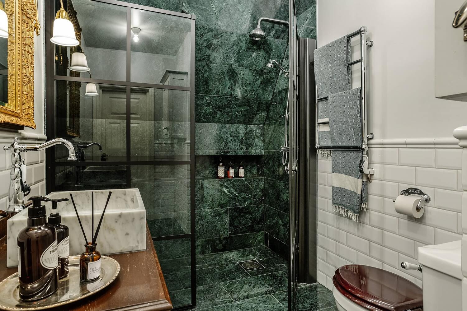 Green Tones and Wallpaper in a Charming Swedish Home 20 bathroom-green-marble-shower-nordroom