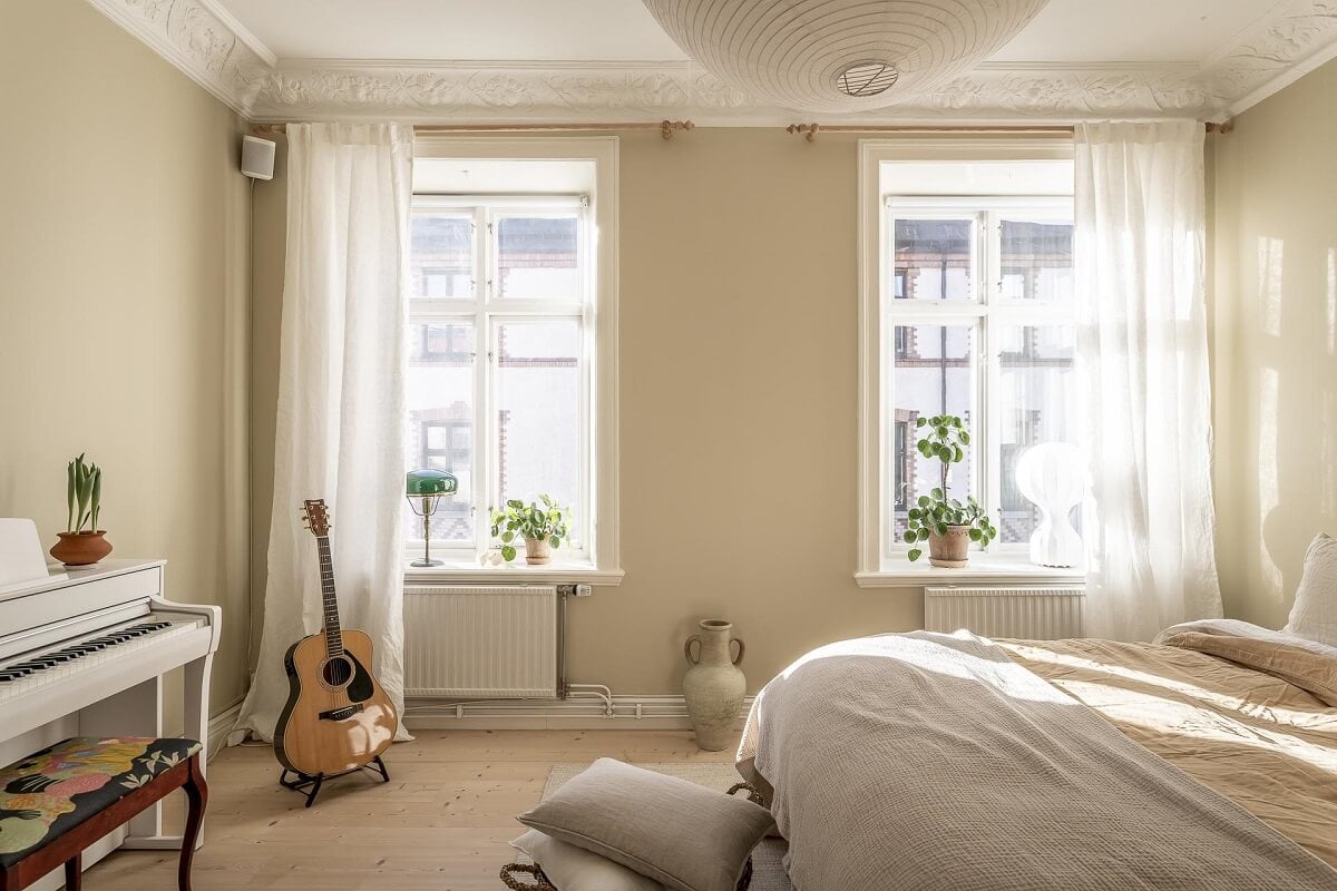 A Scandinavian Apartment with a Pale Yellow Kitchen 20 bedroom-beige-walls-nordroom