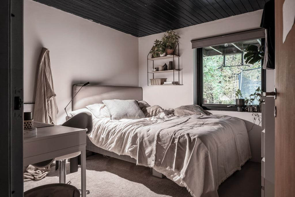 A Renovated Sustainable Home in Sweden 16 bedroom-black-painted-wooden-ceiling-nordroom