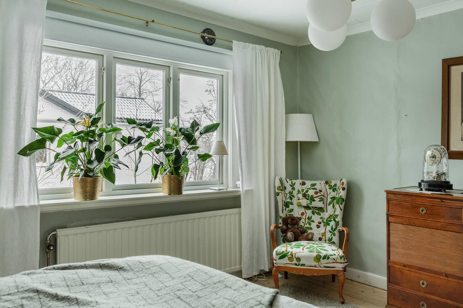 Green Tones and Wallpaper in a Charming Swedish Home 13 bedroom-gray-green-wall-paint-nordroom