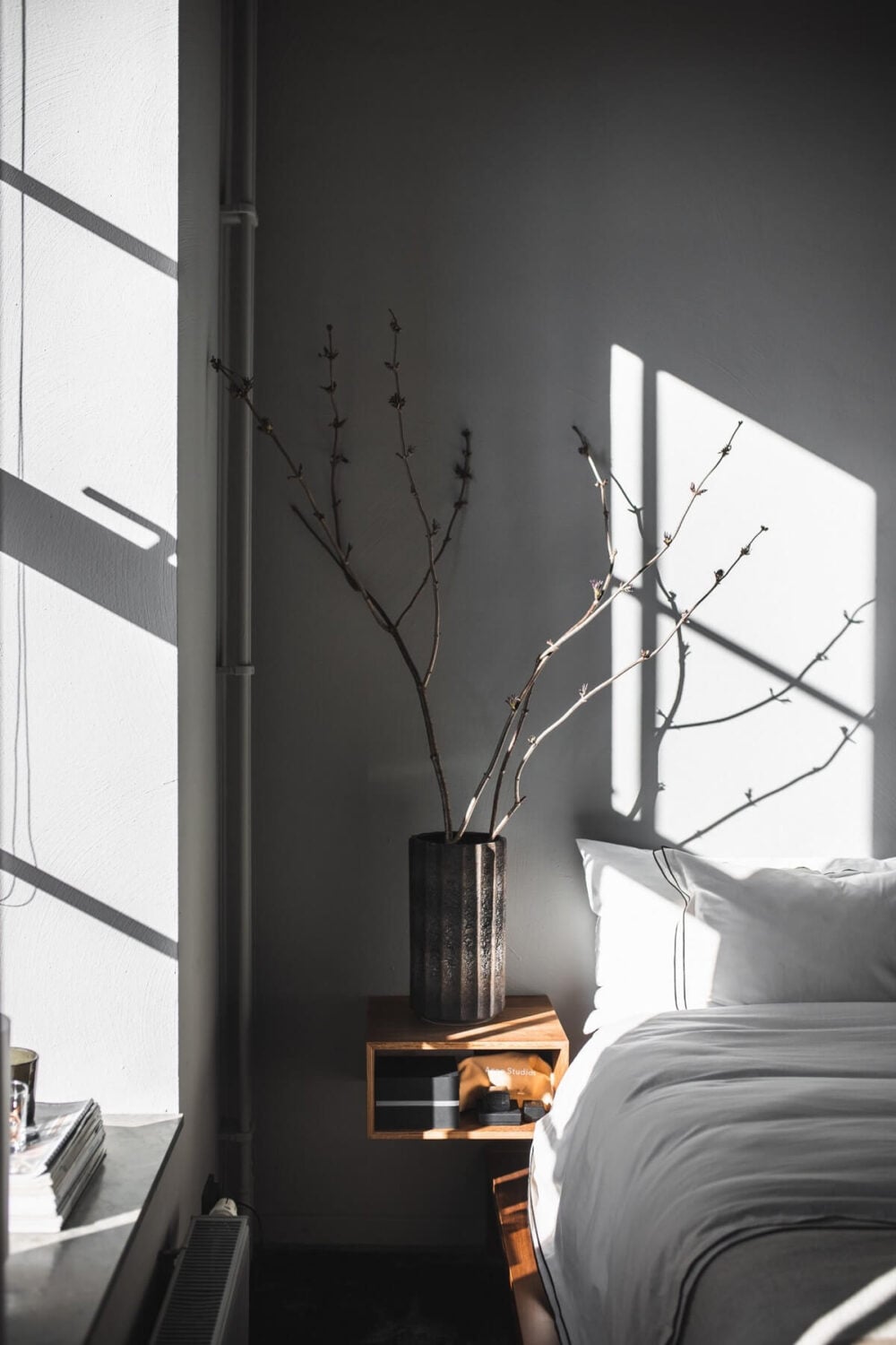 A Modern Gray Industrial Apartment 11 bedroom-gray-walls-floating-nightstand-nordroom