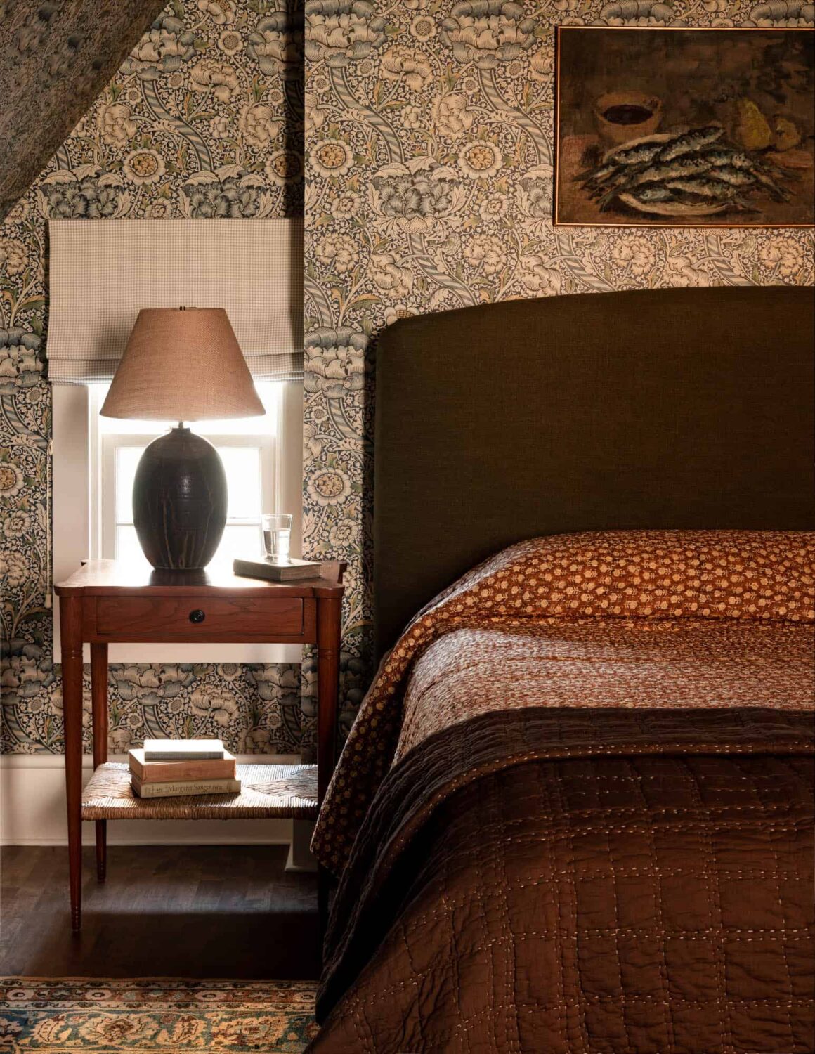 A Cozy Pied-à-Terre with Slanted Ceilings and Wallpaper 22 bedroom-green-bedframe-wallpaper-heidi-caillier-nordroom