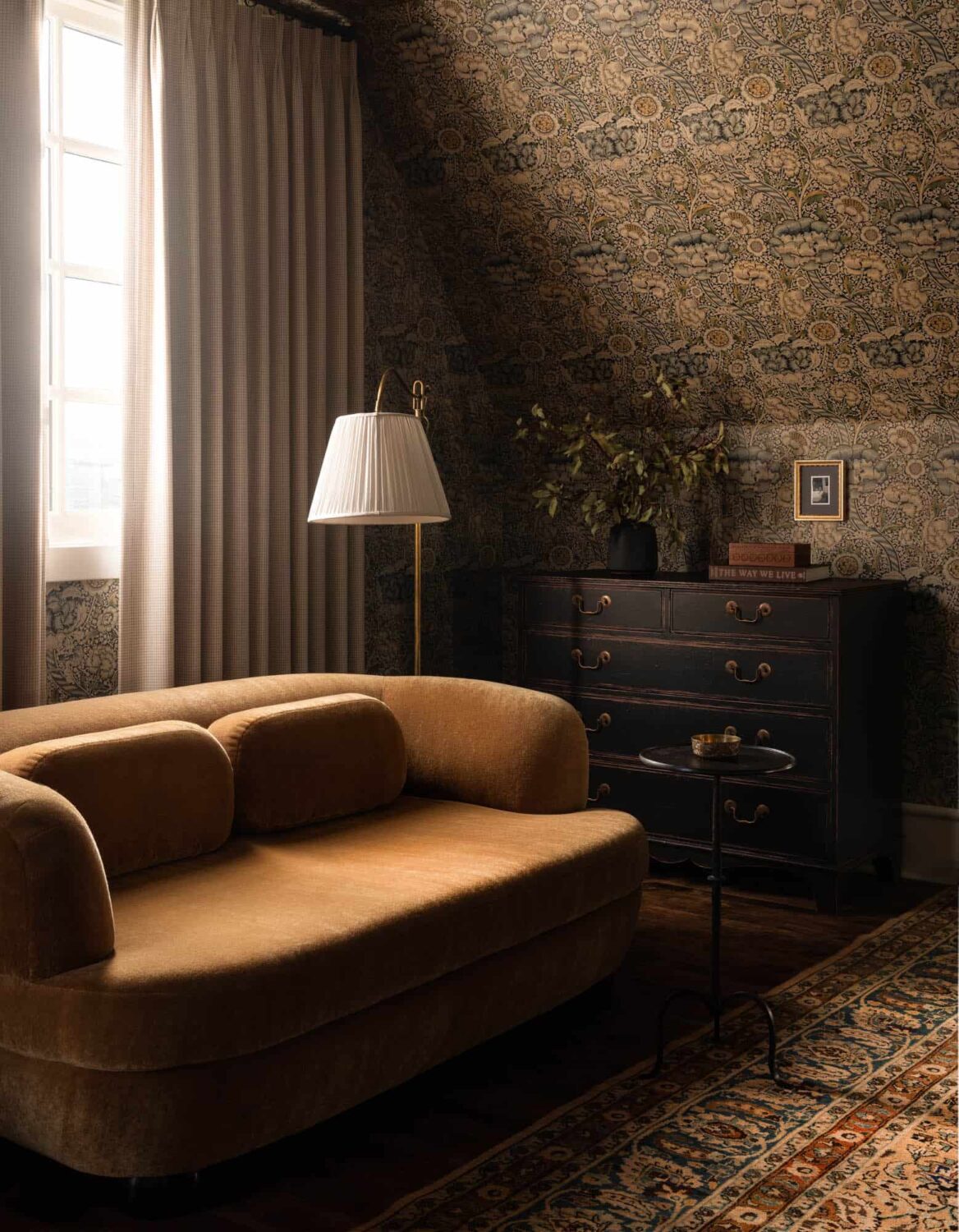 A Cozy Pied-à-Terre with Slanted Ceilings and Wallpaper 21 bedroom-ochre-yellow-sofa-wallpaper-slanted-ceiling-nordroom