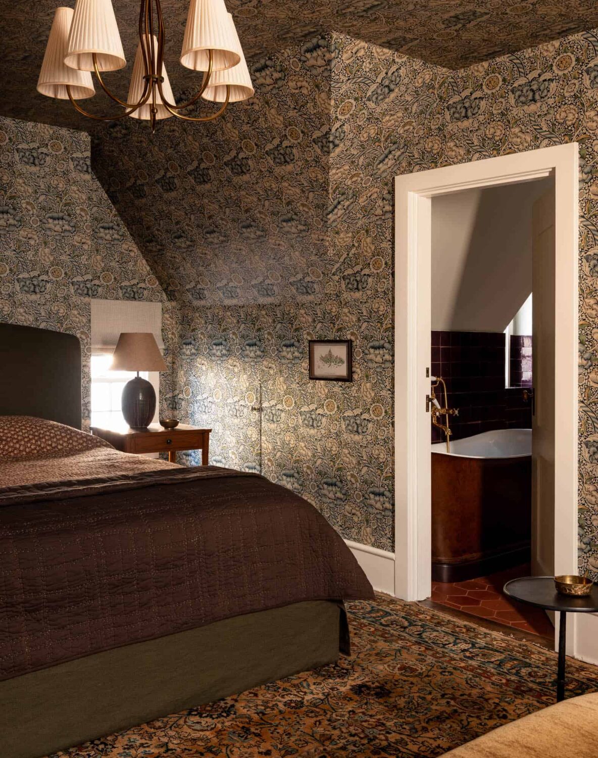 A Cozy Pied-à-Terre with Slanted Ceilings and Wallpaper 20 bedroom-wallpapered-walls-ceiling-heidi-caillier-nordroom