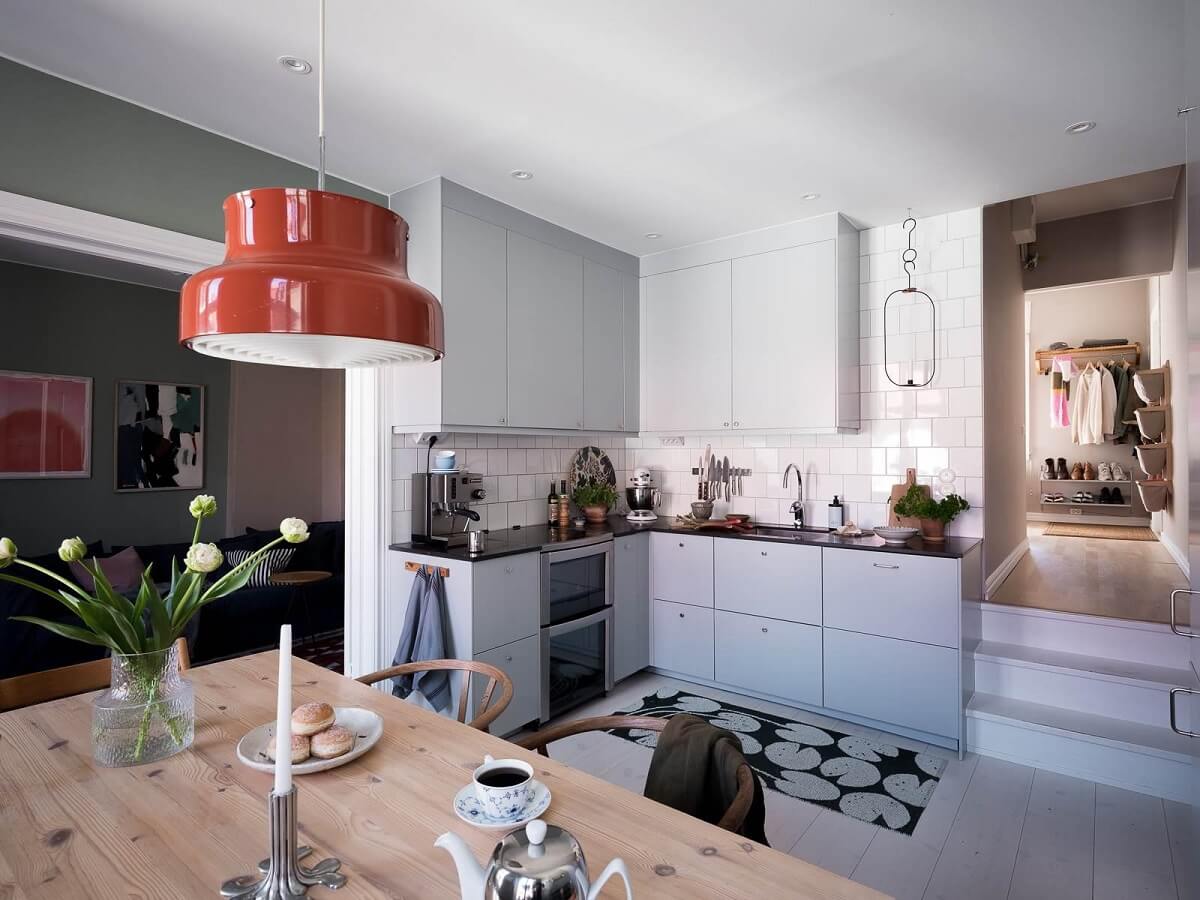 A Scandinavian Duplex That Blends Old and New 8 blue-gray-kitchen-cabinets-modern-design-scandinavian-duplex-apartment-nordroom