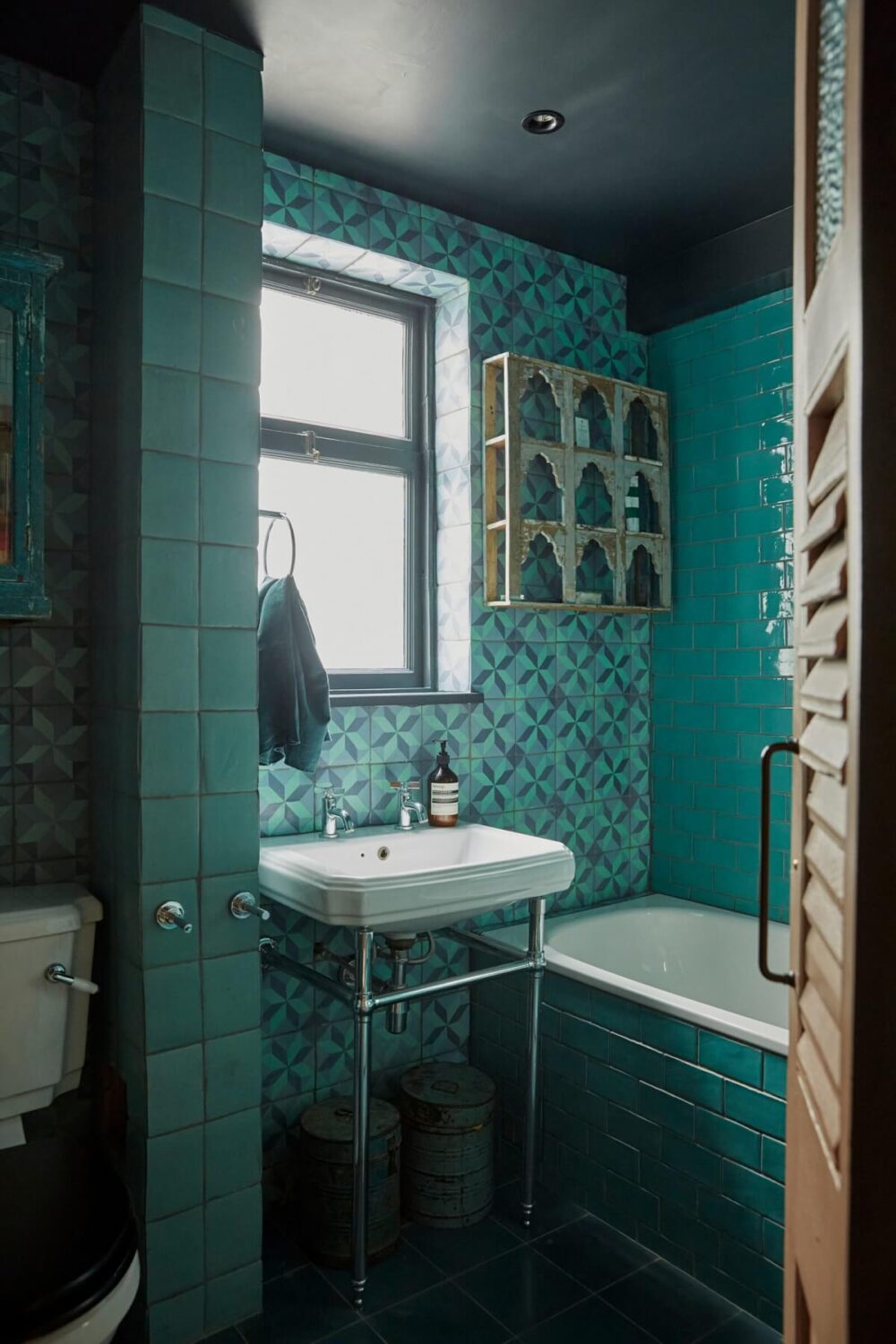 Jewel-Toned Hues in a Vibrant Eclectic Mews House 16 blue-moroccan-style-bathroom-black-ceiling-nordroom