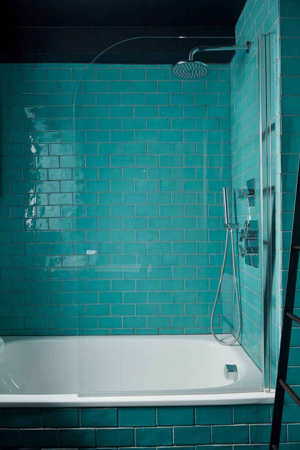 Jewel-Toned Hues in a Vibrant Eclectic Mews House 17 blue-tiles-black-ceiling-moroccan-style-bathroom-nordroom