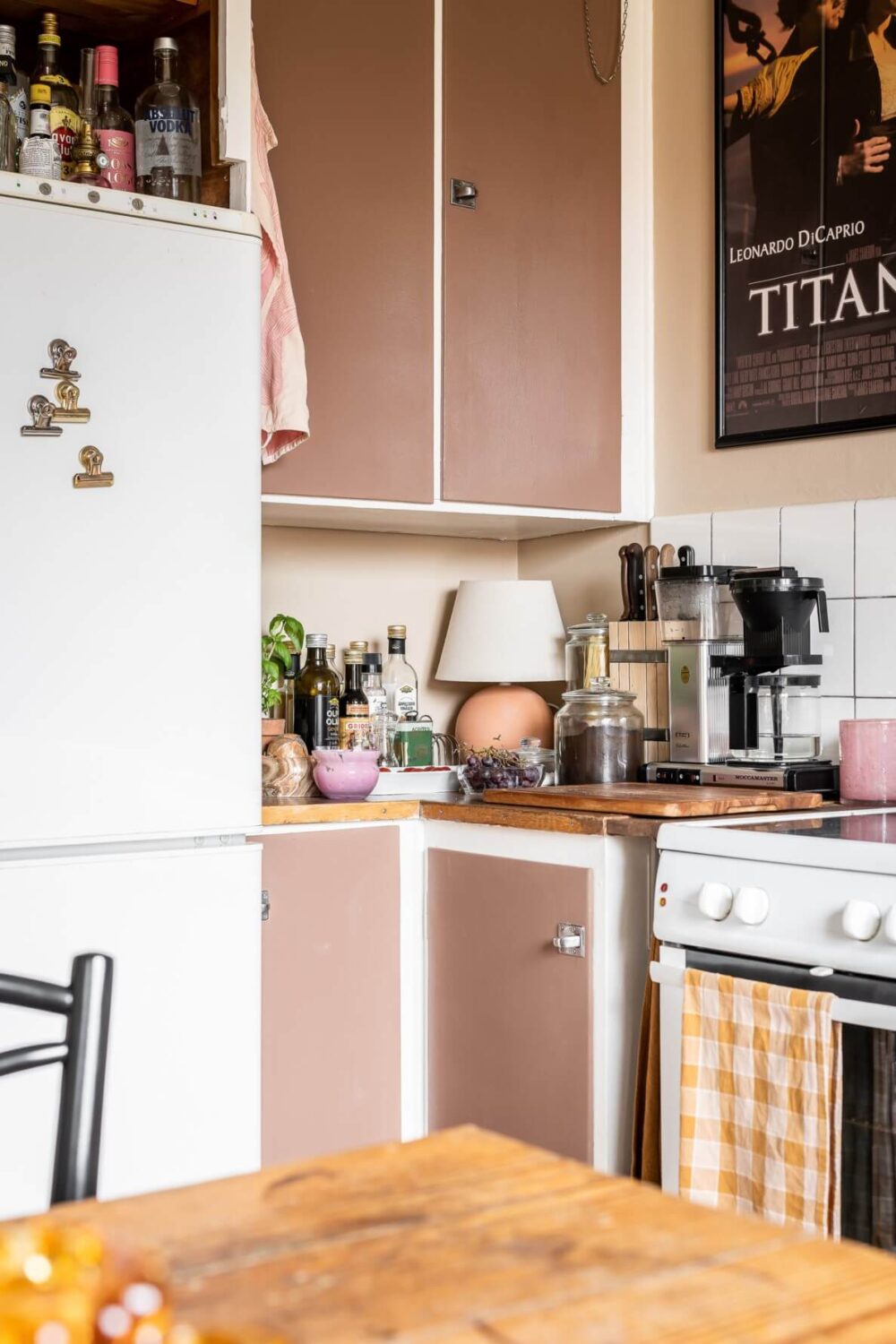 A Pink Studio Apartment with a Midcentury Kitchen 13 brown-pink-kitchen-cabinets-nordroom