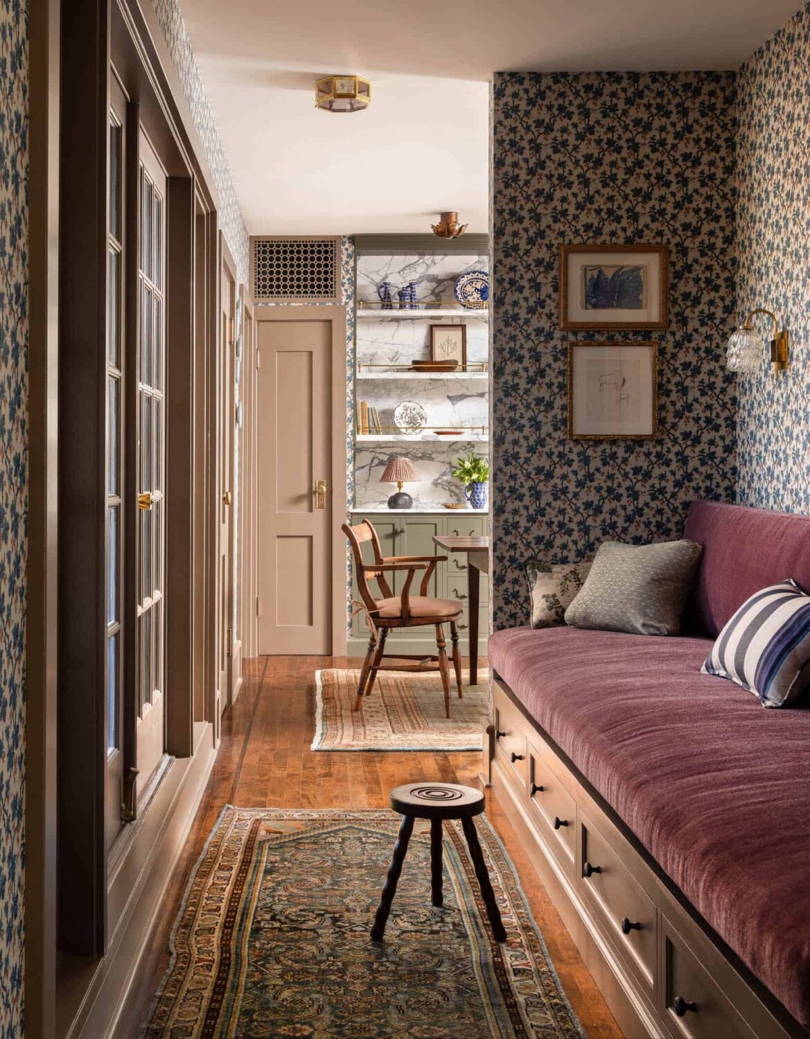 A Cozy Pied-à-Terre with Slanted Ceilings and Wallpaper 13 built-in-bench-purple-fabric-wallpaper-attic-apartment-nordroom