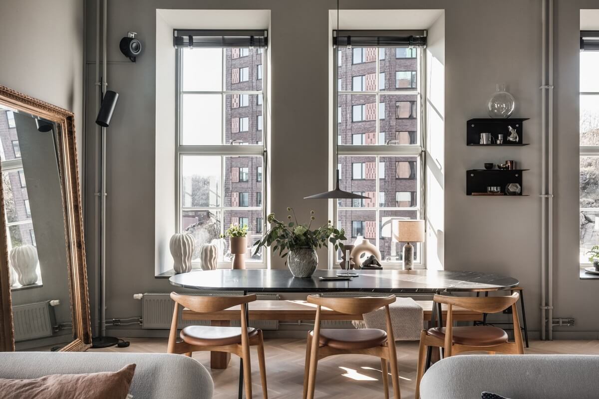 A Modern Gray Industrial Apartment 3 dining-area-industrial-home-large-mirror-nordroom