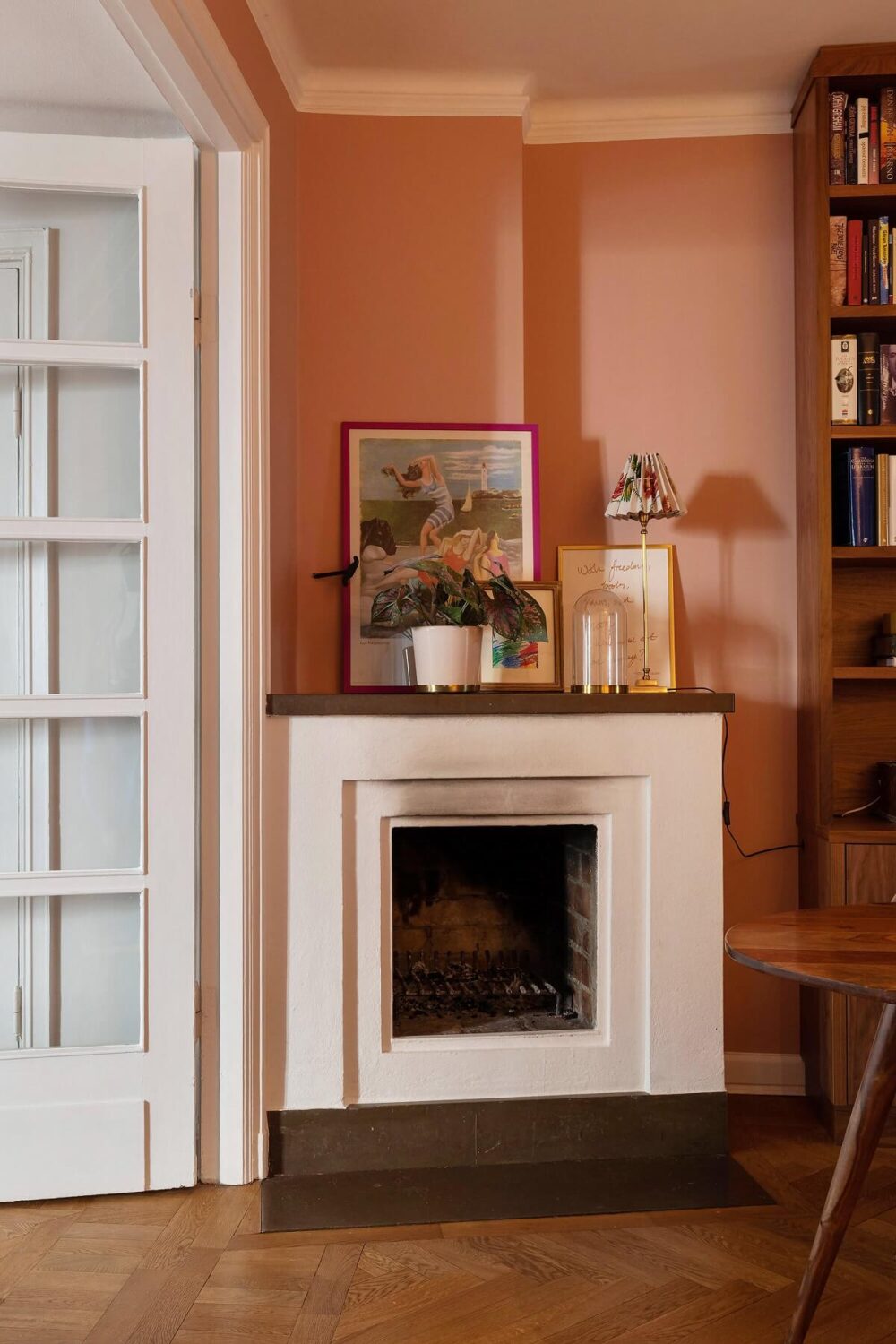 A Serene Nordic Apartment with Pink Color Accents 11 dining-room-fireplace-wooden-floor-nordroom
