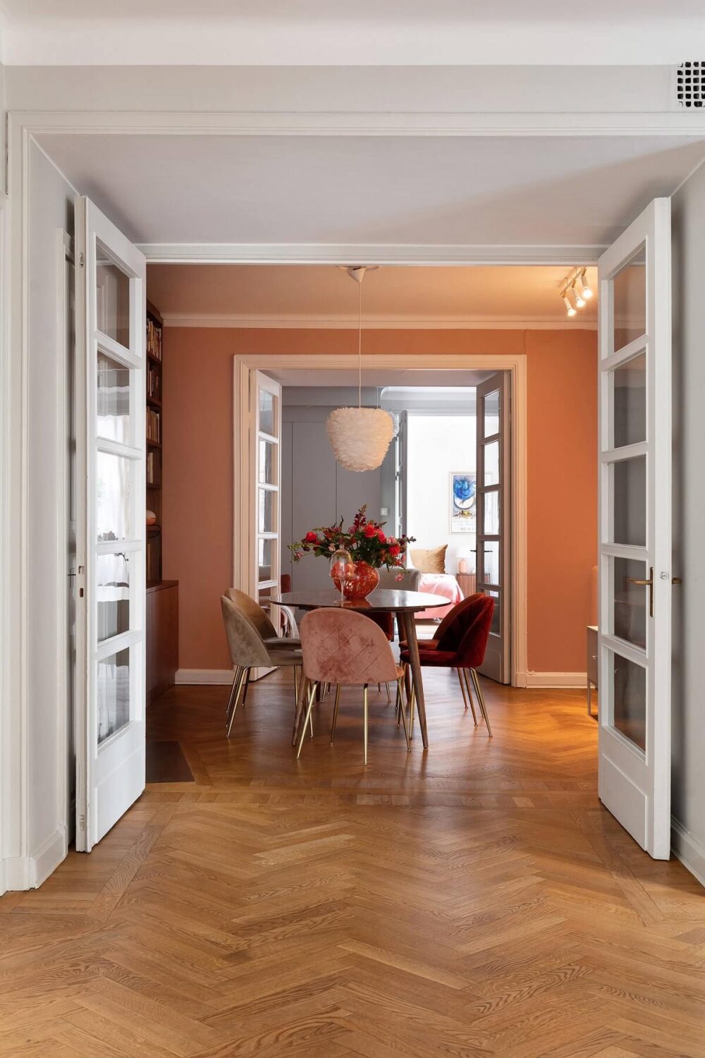 A Serene Nordic Apartment with Pink Color Accents 10 dining-room-terracotta-wall-paint-wooden-floor-nordroom