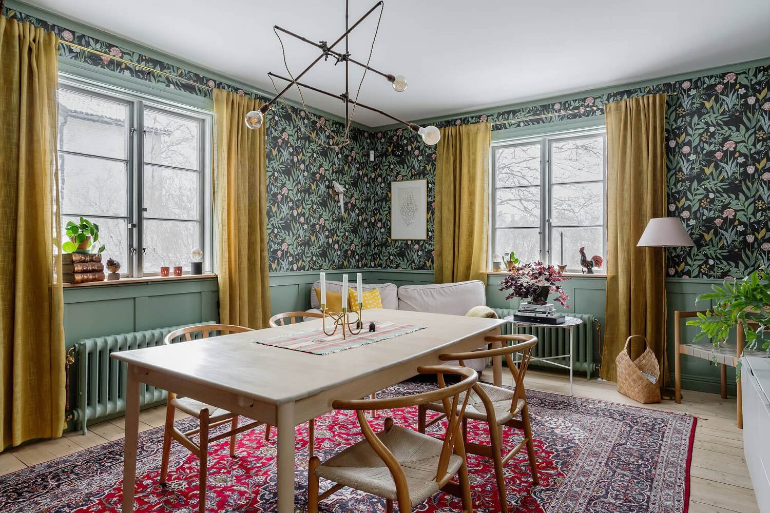 Green Tones and Wallpaper in a Charming Swedish Home 2 dining-table-living-room-floral-wallpaper-yellow-curtains-nordroom