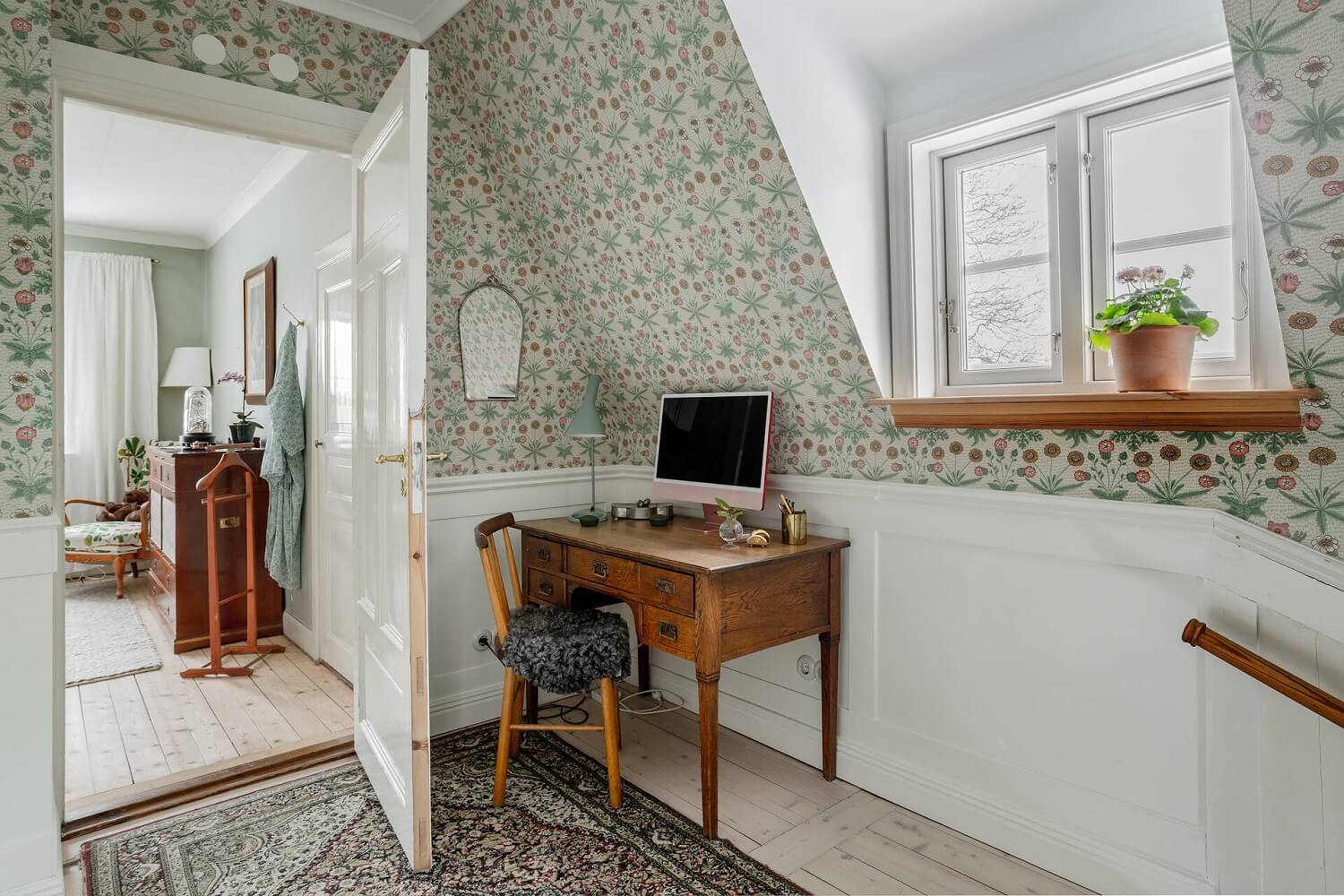 Green Tones and Wallpaper in a Charming Swedish Home 16 first-floor-landing-wallpaper-slanted-ceiling-home-office-nordroom