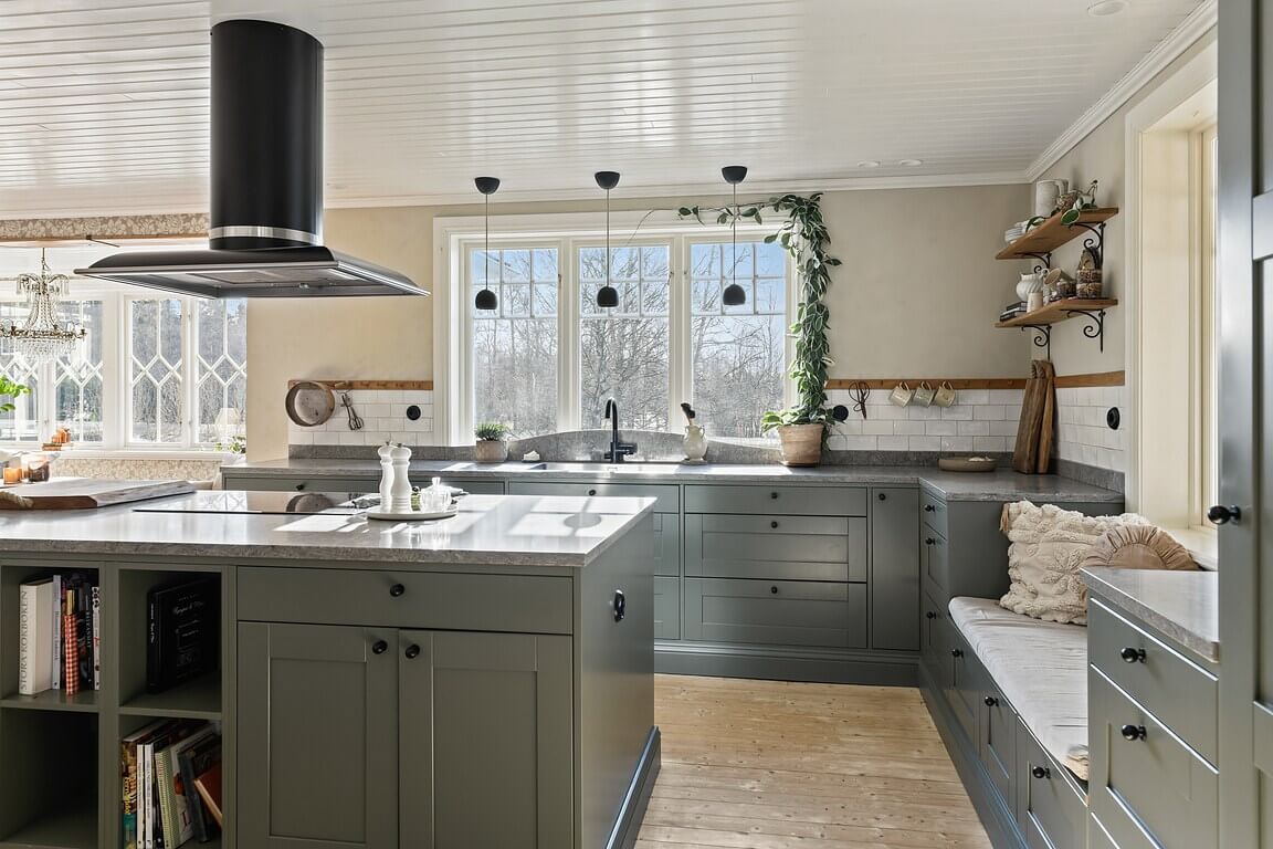 An Idyllic Family Home in the Swedish Countryside 5 gray-green-kitchen-cabinets-island-window-seat-nordroom
